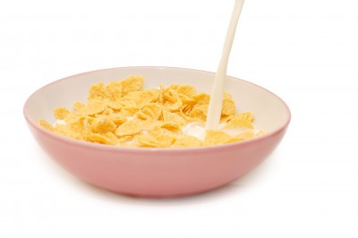 Corn flakes in bowl with milk